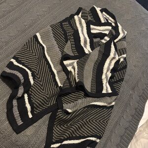 Asymmetrical knit sweater vest.